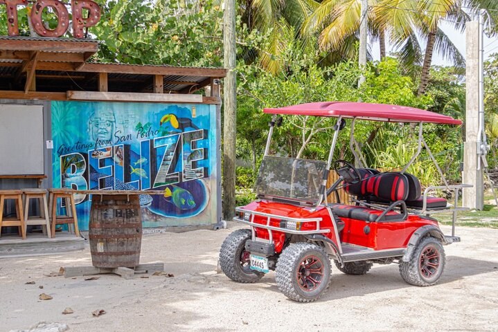 Golf cart in San Pedro with Belize mural
